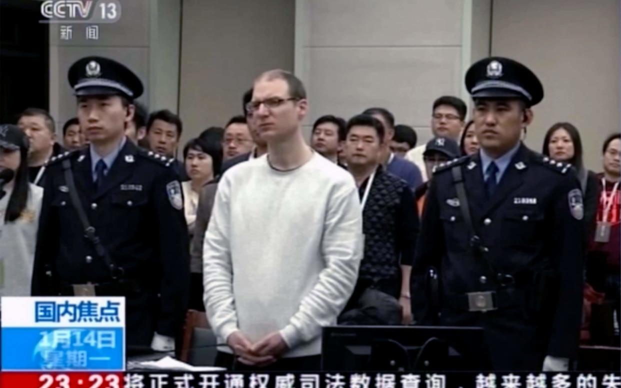 Canadian Robert Lloyd Schellenberg attends his retrial at the Dalian Intermediate People's Court in Dalian, northeastern China - CCTV