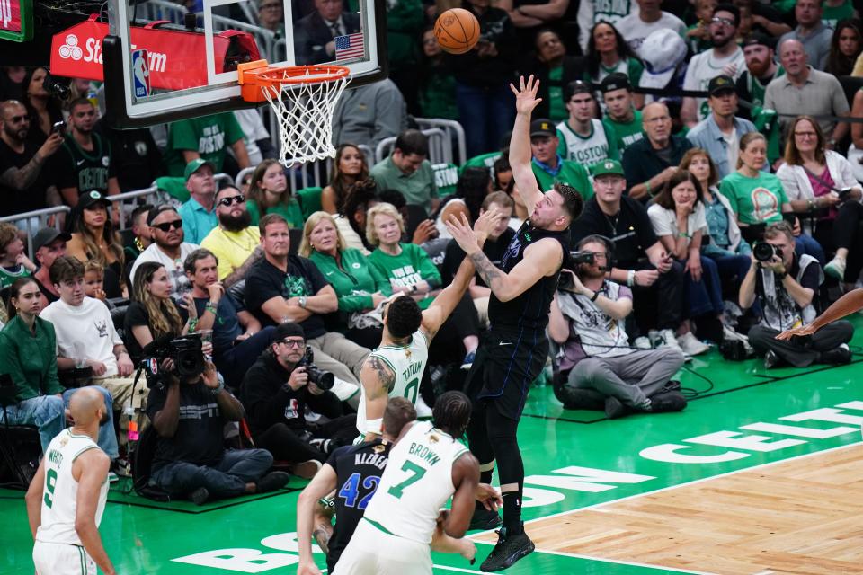 Dallas Mavericks guard Luka Doncic shoots during the second quarter against the Boston Celtics.