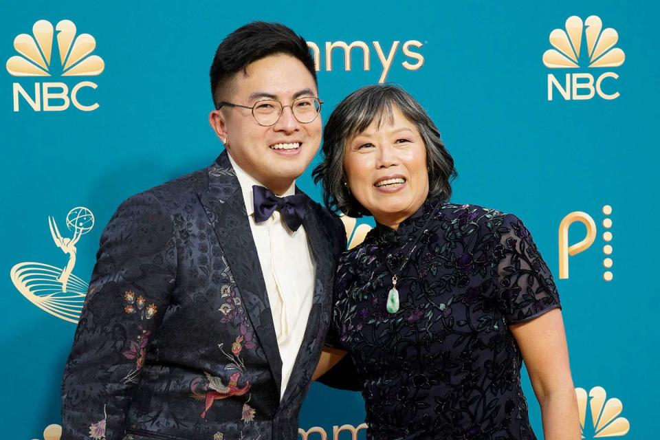 <p>Evans Vestal Ward/NBC via Getty</p> Bowen Yang and his mom Meng at the Emmy Awards in 2022.