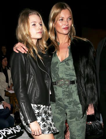 <p>Danny E. Martindale/Getty</p> Kate Moss and her sister Lottie Moss attend the Topshop Unique show at London Fashion Week AW14 on Feb. 16, 2014 in London, England.