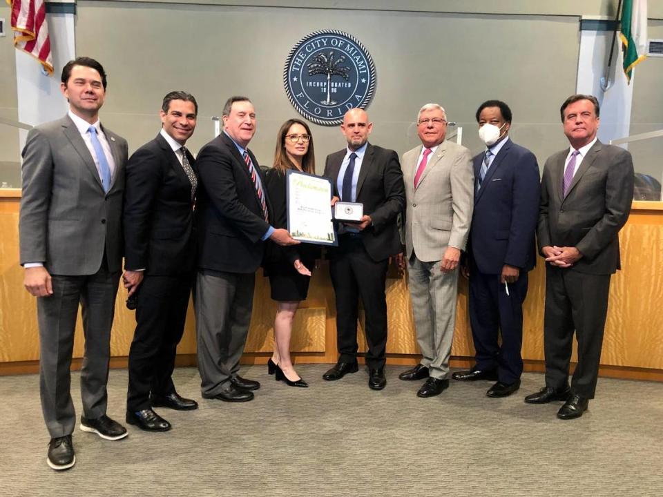 Commissioners and state Sen. Ileana Garcia present Miami’s Israel Consul General, center, with $1 million commitment of investment of surplus city public funds in Israeli government bonds.