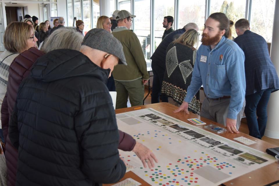 Christopher Morgan, community planner with the National Park Service's Rivers, Trails and Conservation Assistance program, meets with interested visitors during a public input session for the Egg Harbor Trails Initiative held Dec. 14 at the Kress Pavilion.