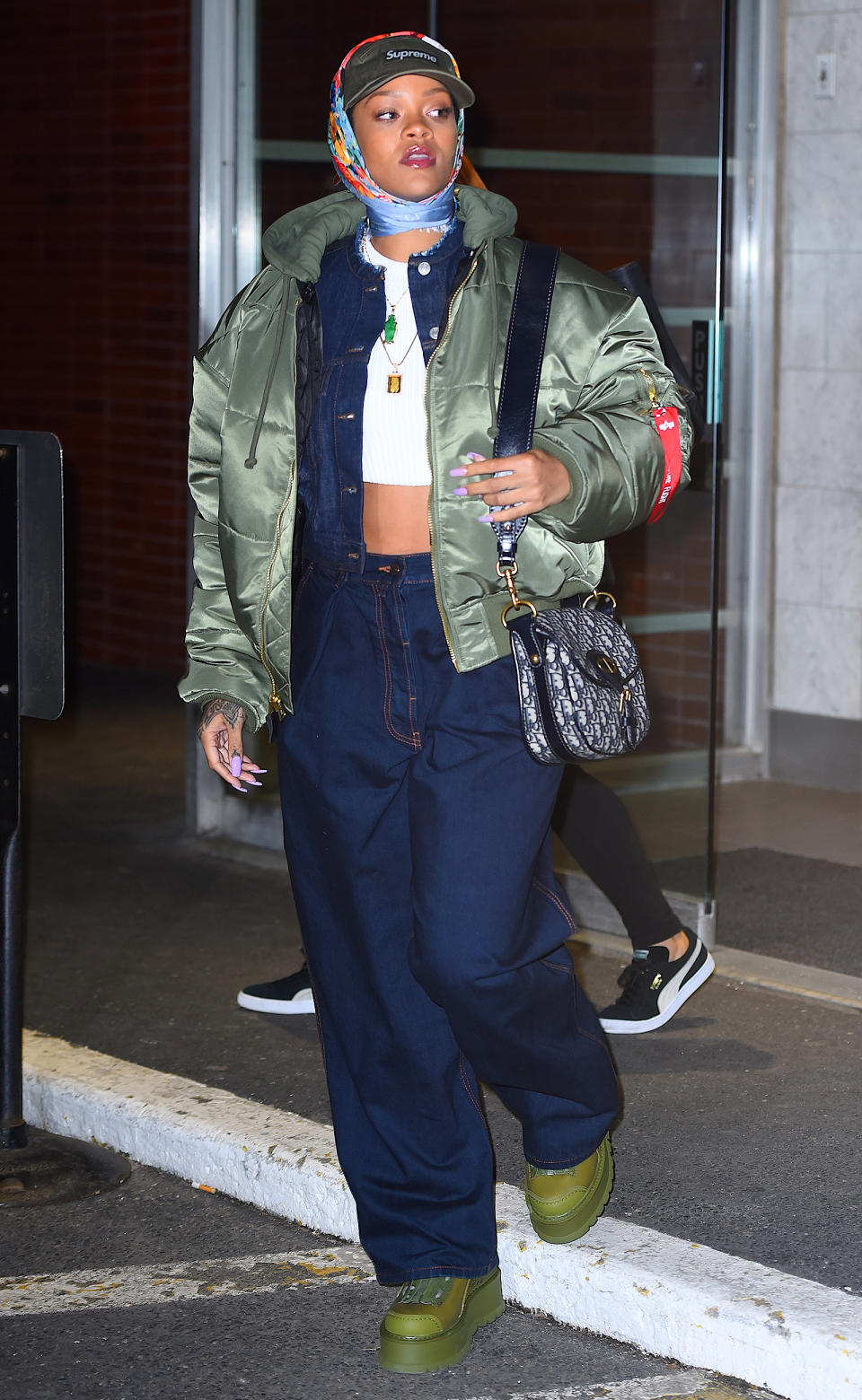 <p>Rihanna is a master of merging disparate trends - and what could be more polar opposite than fusing together a Supreme hat and giant JNCO-style jeans with a headscarf stolen straight from Little Edie's personal collection.</p>