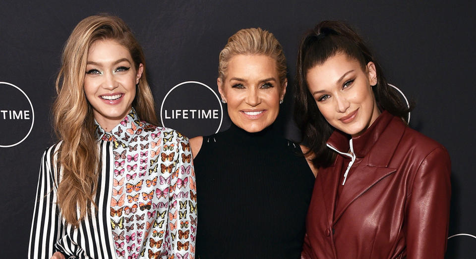 Yolanda Hadid, middle, pictured with daughters Gigi, left, and Bella. [Photo: Getty]