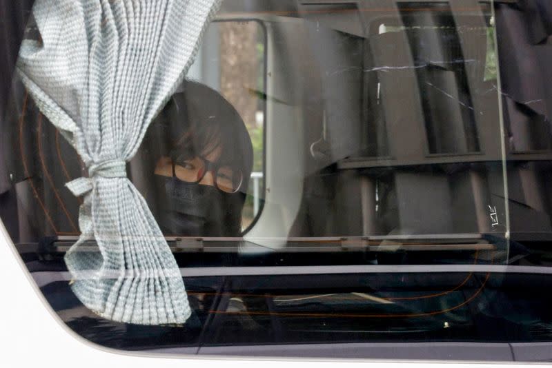 FILE PHOTO: Hong Kong Alliance in Support of Patriotic Democratic Movements of China Vice-Chairwoman Tonyee Chow is seen inside a vehicle after being detained in Hong Kong