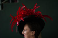 A race fan walks through the grounds of Churchill Downs before the 150th running of the Kentucky Derby horse race Saturday, May 4, 2024, in Louisville, Ky. (AP Photo/Charlie Riedel)