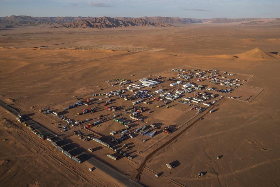 In this Wednesday, Jan. 8, 2020 photo, an overview of the Dakar rally bivouac in Al Ula, in Saudi Arabia. Formerly known as the Paris-Dakar Rally, the race was created by Thierry Sabine after he got lost in the Libyan desert in 1977. Until 2008, the rallies raced across Africa, but threats in Mauritania led organizers to cancel that year's event and move it to South America. It has now shifted to Saudi Arabia. The race started on Jan. 5 with 560 drivers and co-drivers, some on motorbikes, others in cars or in trucks. Only 41 are taking part in the Original category. (AP Photo/Bernat Armangue)