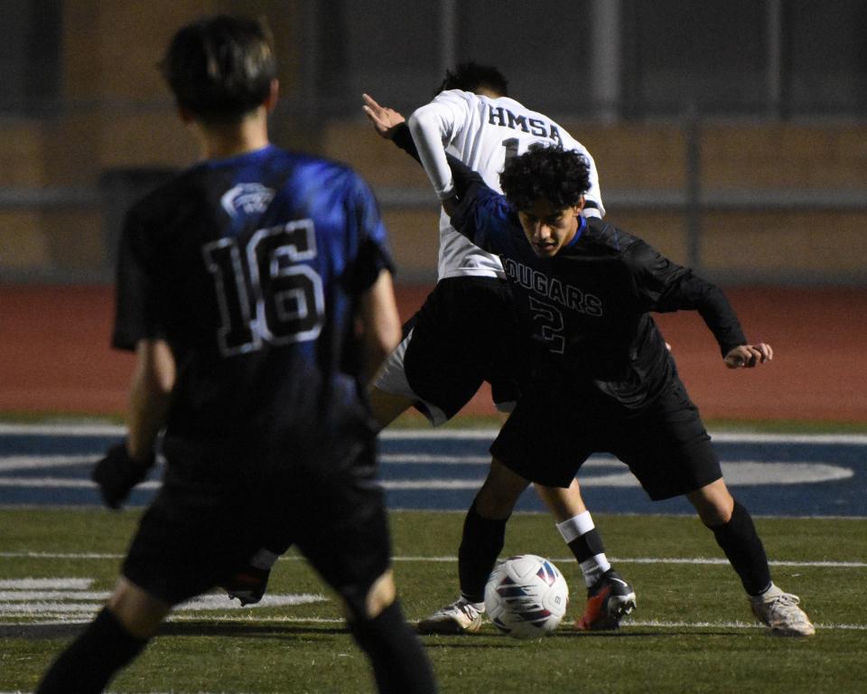 Cobalt Institute of Math & Science Academy's Carlos Covarrubias keeps the ball away from a Hawthorne's MSA during the in second round of CIF-Southern Division 7 playoffs on Tuesday, Feb. 13, 2024 in Victorville. CIMS won 2-0 and advanced to the to the quarterfinals.