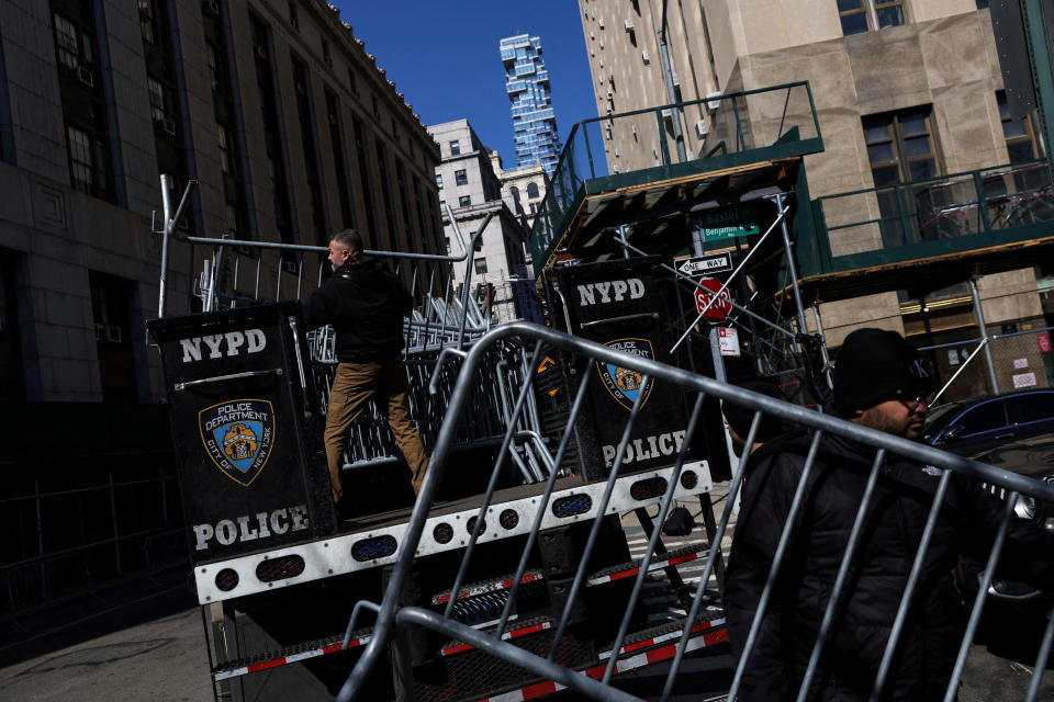 The New York City Police Department, working out of a blue truck marked NYPD, sets up barricades outside Manhattan Criminal Court in lower Manhattan. 