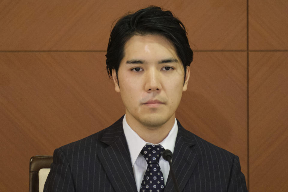 FILE - Kei Komuro, the husband of Japan's former Princess Mako, attends a press conference to announce their marriage, at a hotel in Tokyo on Oct. 26, 2021. Komuro has passed the New York bar exam, defying detractors back home who had criticized their romance. (Nicolas Datiche/Pool Photo via AP, File)