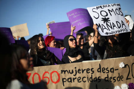 Activists take part in a march to protest violence against women and the murder of a 16-year-old girl in a coastal town of Argentina last week, at Revolucion monument, in Mexico City, Mexico, October 19, 2016. REUTERS/Edgard Garrido