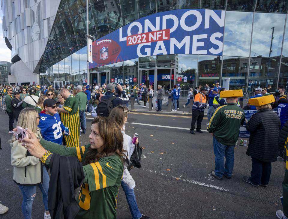 A fan makes a selfie before the Green Bay Packers game against the New York Giants on Oct. 9, 2022, outside Tottenham Hotspur Stadium in London.