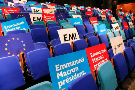 Placards in support of Emmanuel Macron, head of the political movement En Marche ! (Onwards !) and candidate for the 2017 presidential election, are seen before a campaign rally in Besancon, France, April 11, 2017. REUTERS/Robert Pratta