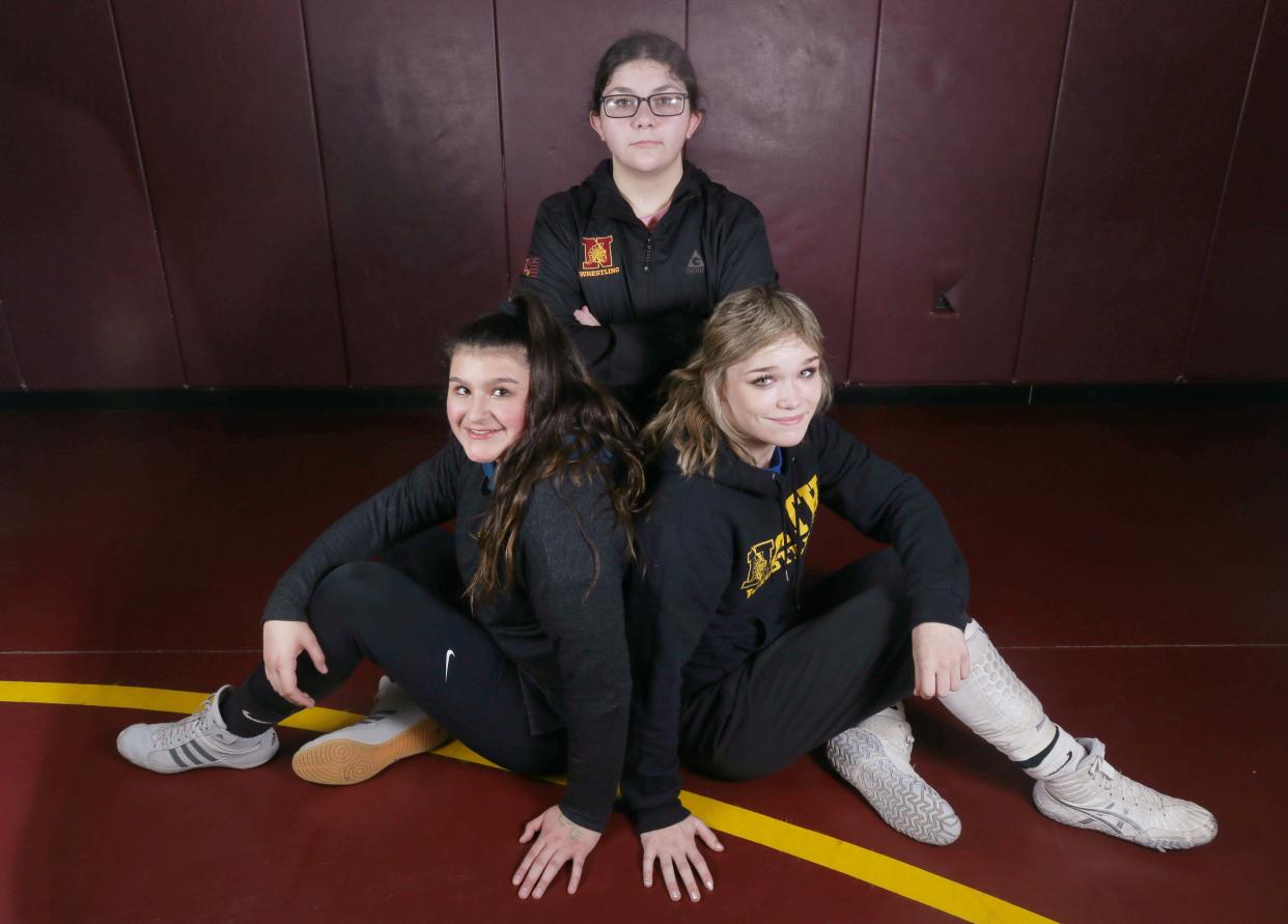 North girls wrestlers (from left) Giselle Duran, Marvet Hejazin and Melania Szawranskyj have been enjoying strong seasons, with each making January's statewide rankings from American Women’s Wrestling.