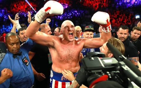 Tyson Fury enjoys his victory - Credit: pa