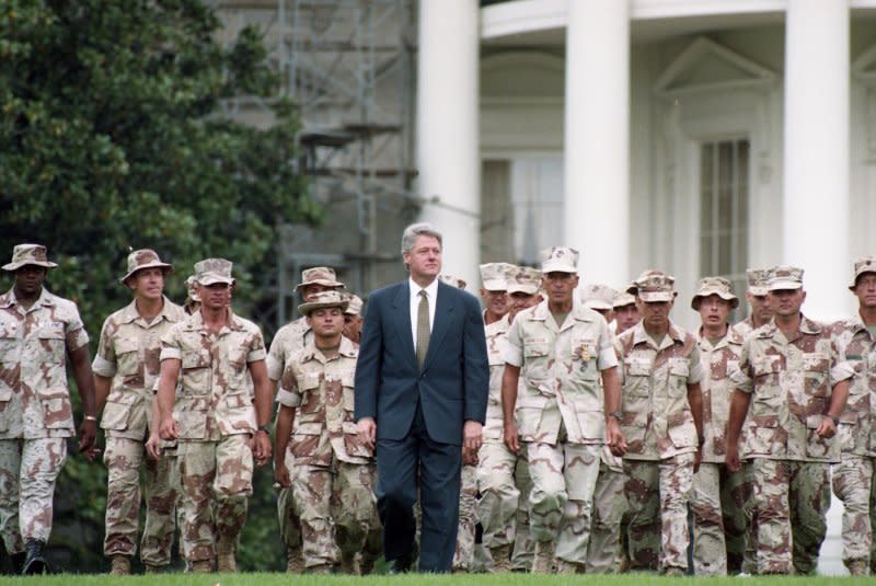 U.S. President Bill Clinton walks with a group of U.S. troops just back from Somalia at a ceremony to honor them on the South Lawn of the White House in Washington on May 5, 1993. On December 9, 1992, some 1,700 U.S. Marines landed in Somalia to secure the airfield, port and U.S. Embassy in Mogadishu and restore order to the conflict- and famine-stricken country. UPI File Photo