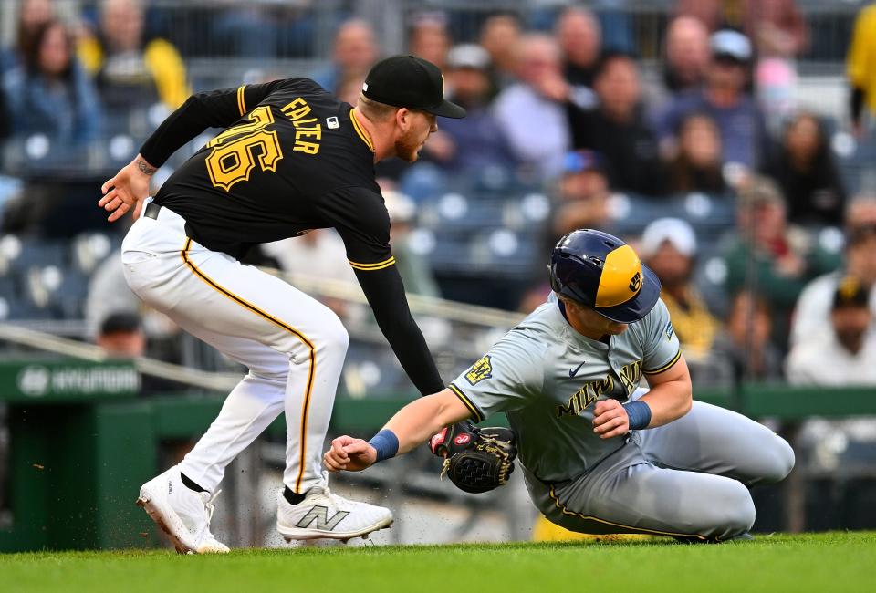 Joey Wiemerof the Milwaukee Brewers is tagged out by Bailey Falter of the Pirates after being caught in a rundown during the third inning Tuesday night at PNC Park.