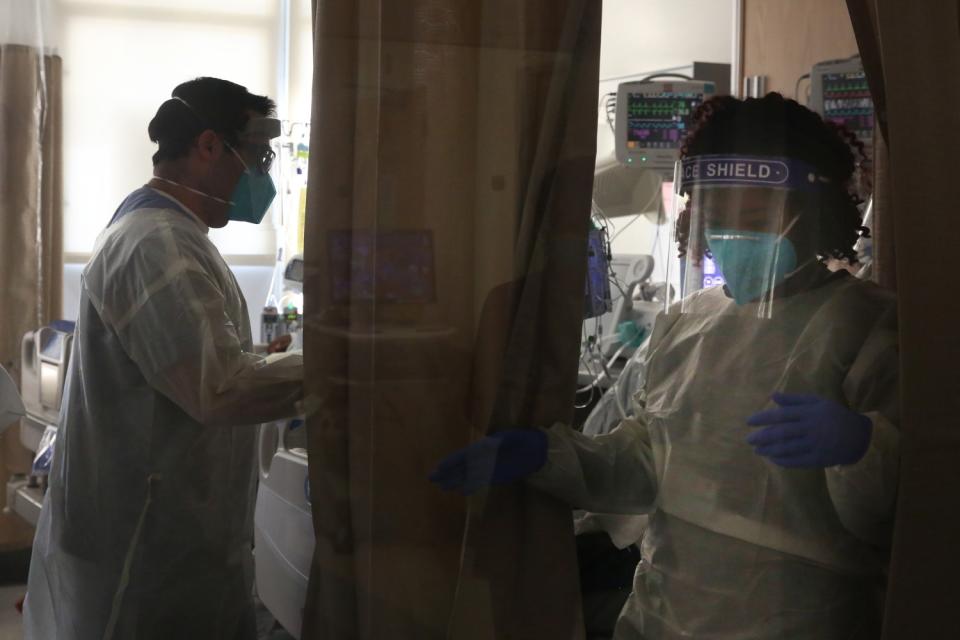 Hospital doctors and nurses treat COVID-19 patients in a makeshift ICU wing at Harbor-UCLA Medical Center.