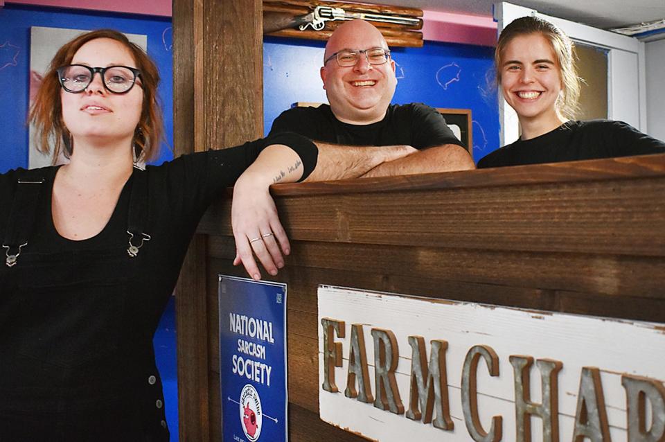 Mari Kilmain, catering manager, owner Mike Crooks and manager of Sarcastic Swine south Tristen Brown.