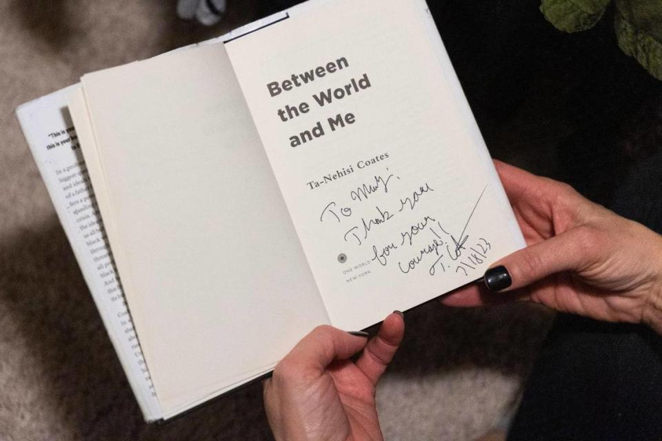 Mary Wood, a teacher at Chapin High School, shows her signed copy of Between the World and Me by Ta-Nehisi Coates on Thursday, November 16, 2023. Wood used the book in a lesson about argumentative writing, and was stopped by the school district.