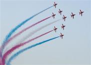 The Red Arrows Royal Air Force Aerobatic Team performs during the Dubai Airshow November 18, 2013. REUTERS/Caren Firouz