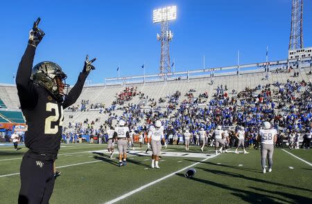 Dec 22, 2018; Birmingham, AL, United States; Wake Forest Demon Deacons defensive back Ja'Sir Taylor (24) celebrates as they defeat the Memphis Tigers on a missed field goal by Memphis Tigers place kicker Riley Patterson (36) during the second half of the Birmingham Bowl at Legion Field. Mandatory Credit: Butch Dill-USA TODAY Sports