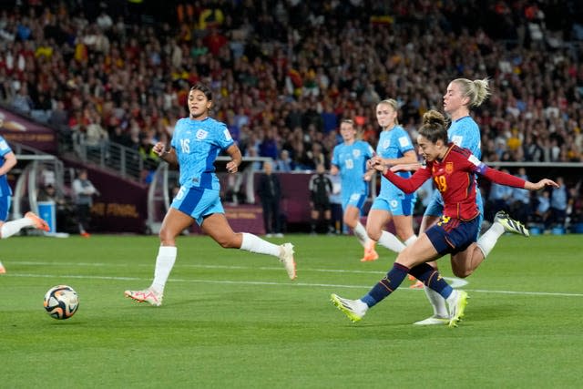 Olga Carmona, right, scores against England