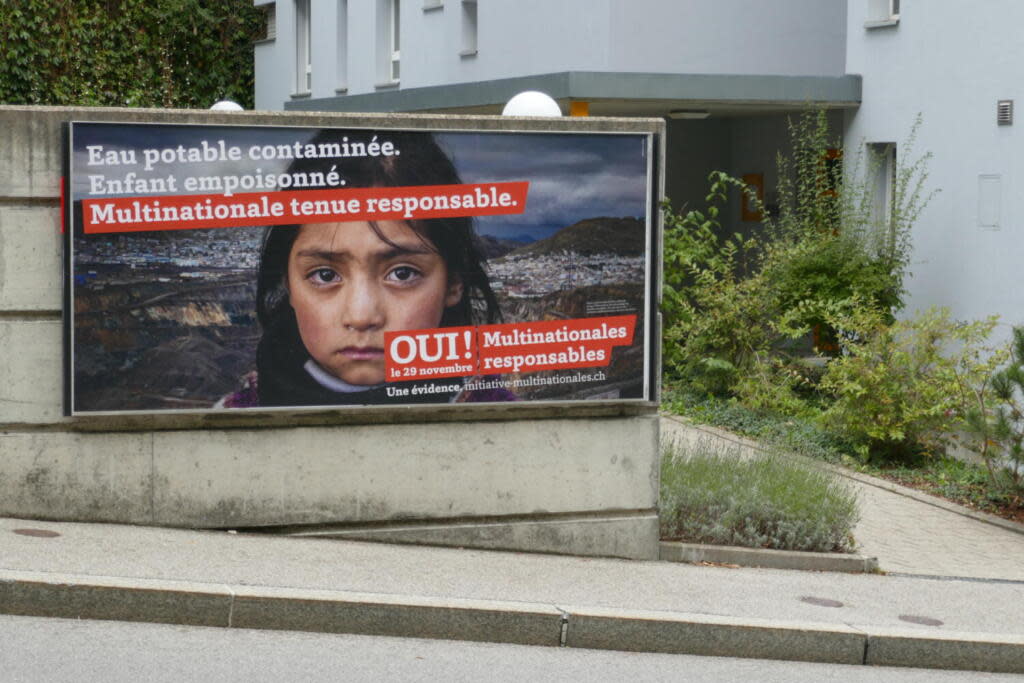 Photo of a campaign sign in Freiburg, Switzerland which reads “ Drinking water in contaminated. The children are poisoned. Multinational organisations are responsible” (L’initiative pour des multinationales responsables)