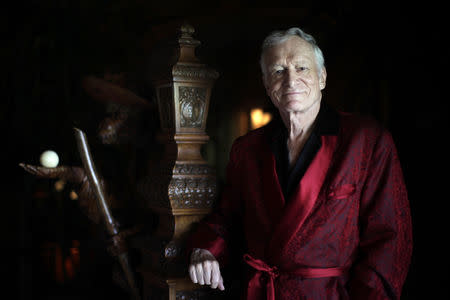 FILE PHOTO: Playboy magazine founder Hugh Hefner poses for a portrait at his Playboy mansion in Los Angeles, California, July 27, 2010. REUTERS/Lucy Nicholson/File Photo