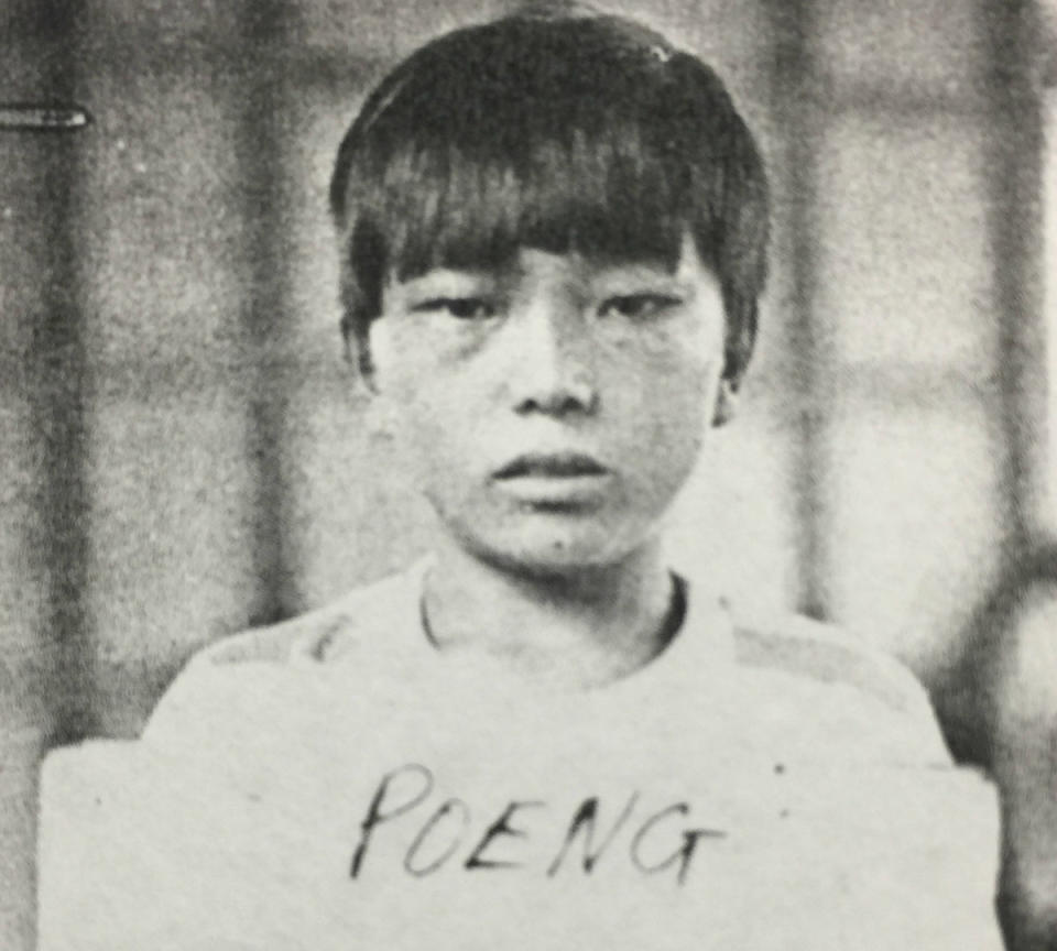 <span class="icon icon--xs icon__camera">  </span> <span class="credit font--s-m upper black"> <b>Courtesy of Family</b> </span> <div class="caption space-half--right font--s-m gray--med db"> Mike Poeng’s refugee ID card photo, taken in Thailand when he was 13. </div>
