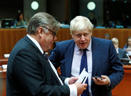 Britain's Foreign Secretary Boris Johnson and his Finnish counterpart Timo Soini attend a European Union foreign ministers meeting in Brussels, Belgium November 14, 2016. REUTERS/Yves Herman