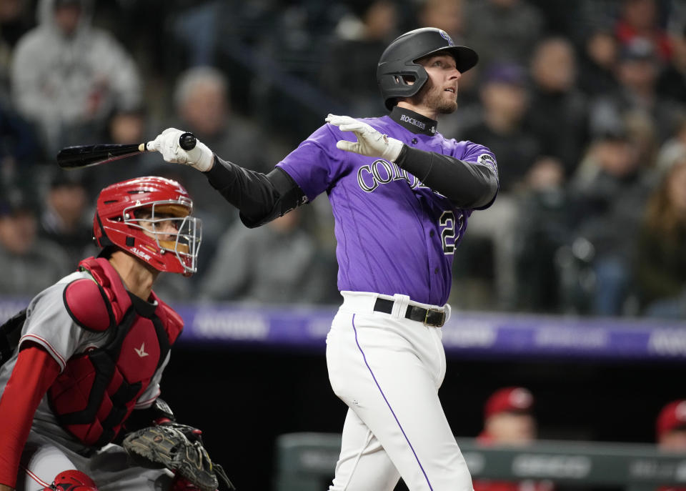 Colorado Rockies' Ryan McMahon watches his three-run home run off Cincinnati Reds starting pitcher Hunter Greene during the fifth inning of a baseball game Friday, April 29, 2022, in Denver. (AP Photo/David Zalubowski)