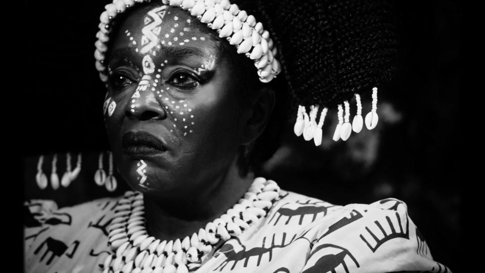 A black and white still of a woman in "Mami Wata."