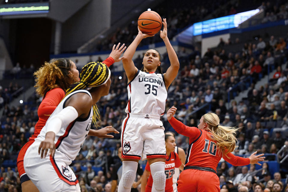 UConn guard Azzi Fudd (35) shoots over Dayton guard Ivy Wolf (10) in the first half of an NCAA college basketball game, Wednesday, Nov. 8, 2023, in Storrs, Conn. (AP Photo/Jessica Hill)