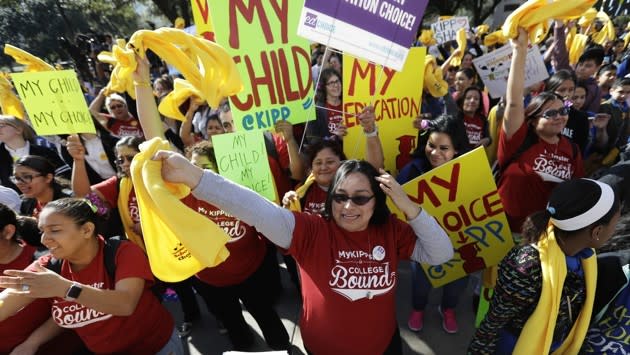 Parents, students and administrators take part in a rally in support of school choice, Tuesday, in Austin, Texas. Eric Gay / AP