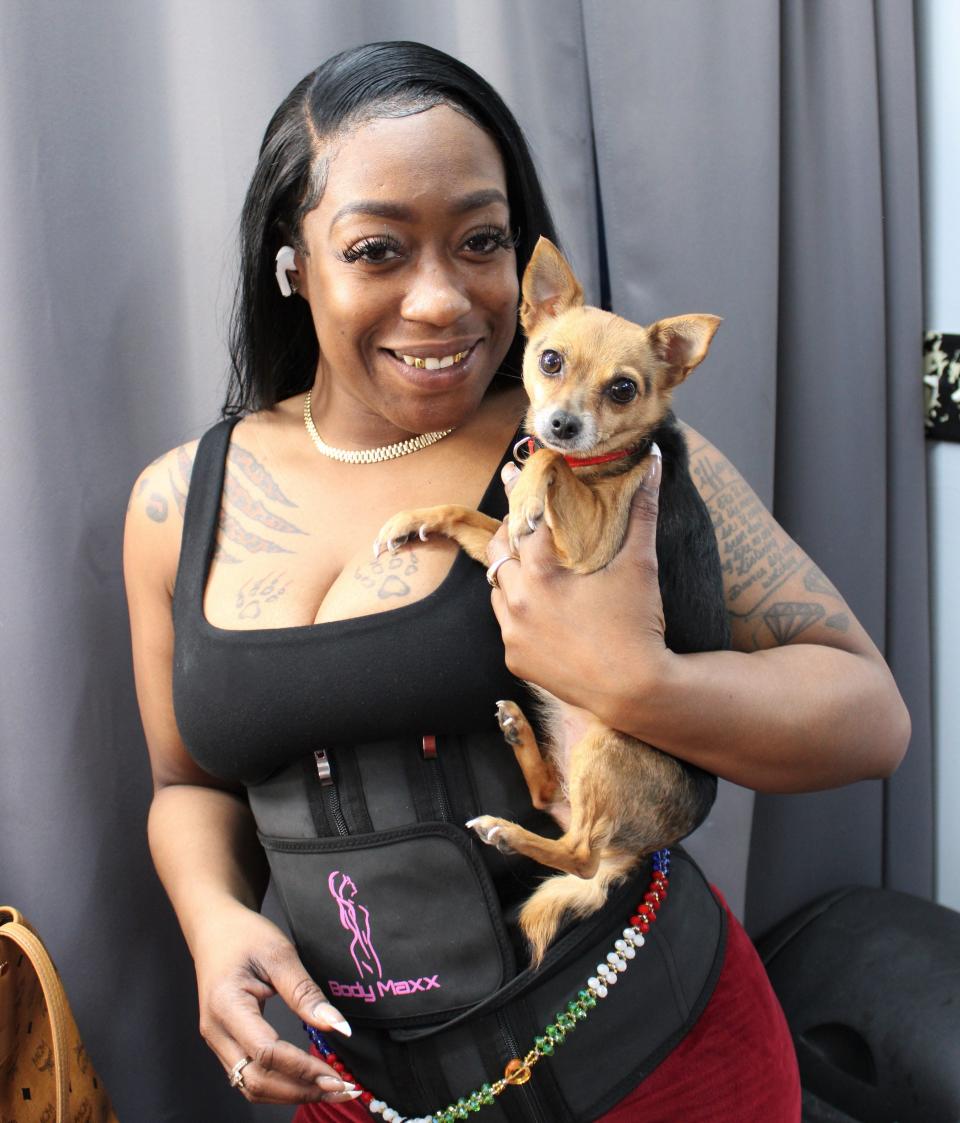 Beautician Tiffany Howard of Petersburg poses with her four-year-old Chihuahua Princess at Personal Touch Beauty & Barber Salon in Old Towne on Feb. 9, 2023.