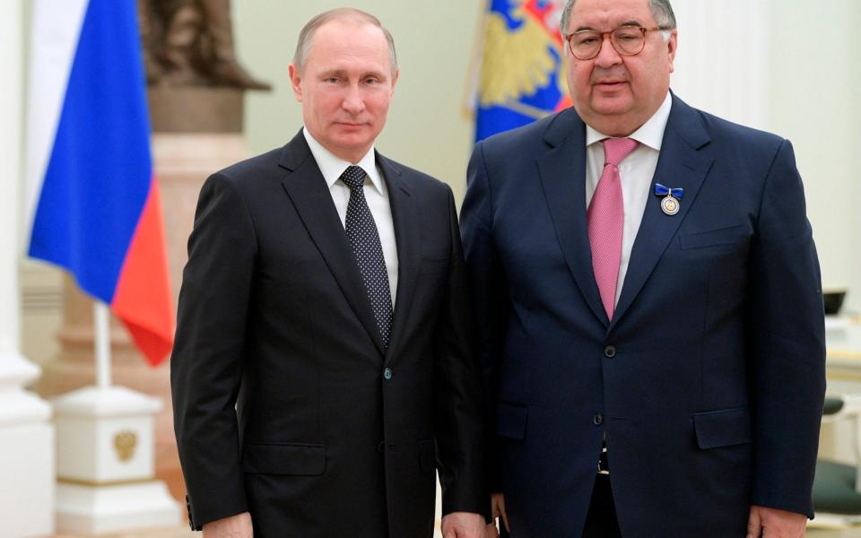 Vladimir Putin, poses for a photo with USM Holdings founder, businessman Alisher Usmanov - Alexei Druzhinin 