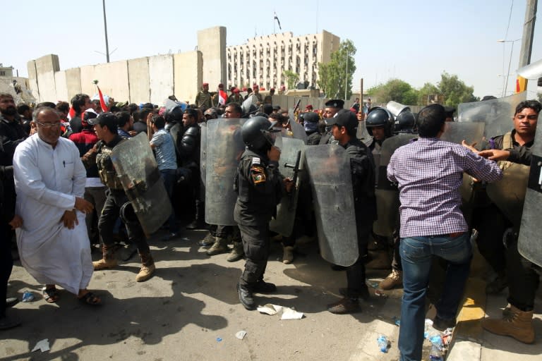 Iraqi security forces try to prevent supporters of cleric Moqtada al-Sadr from entering Baghdad's heavily fortified "Green Zone" the day after angry protesters broke into the area on May 1, 2016