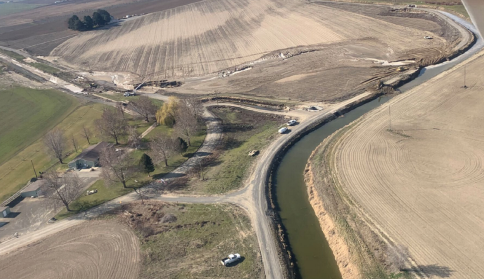 The South Columbia Basin Irrigation District reported a breach in the Potholes Canal north of Pasco. Water flowed from the canal in the upper right corner of this photo and across a field before entering a lateral canal to the left.