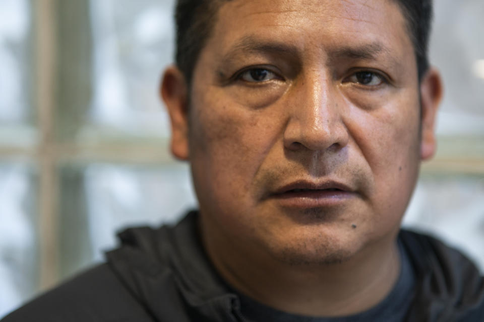 Ecuadorian immigrant Neptali Chiluisa poses for a picture during an interview inside his temporary house in the borough of Bronx on Thursday, Oct. 21, 2021, in New York. Chiluisa crossed the border in June in Arizona and was detained for a week with his 14-year-old son, leaving behind his wife and three other children in Ecuador. He acknowledges coming for economic reasons and wonders if he has any options for temporary legal status. “The U.S. needs workers, so policies should be less harsh with us,” he said. “We come to work.” (AP Photo/Eduardo Munoz Alvarez)