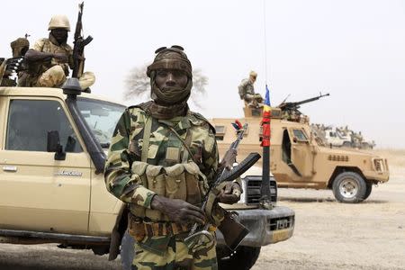 A Chadian soldier poses for a picture at the front line during battle against insurgent group Boko Haram in Gambaru, February 26, 2015. REUTERS/Emmanuel Braun