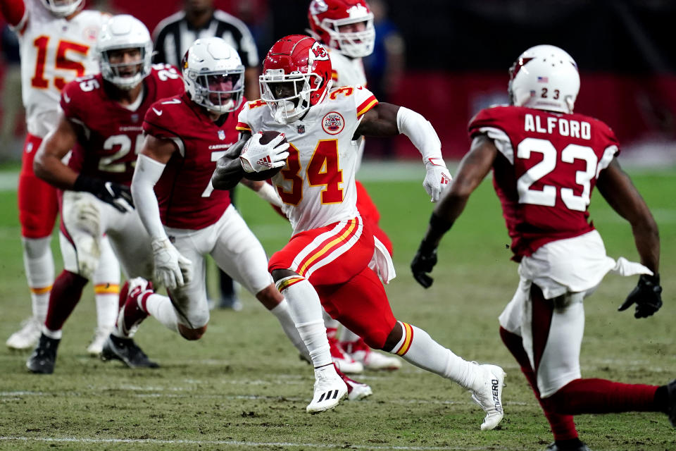 Kansas City Chiefs running back Darwin Thompson (34) runs as Arizona Cardinals cornerback Robert Alford (23) defends during the first half of an NFL football game, Friday, Aug. 20, 2021, in Glendale, Ariz. (AP Photo/Ross D. Franklin)