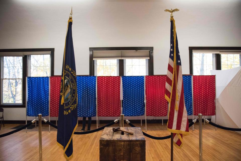 A person votes inside a voting booth in Newfields, New Hampshire, on Nov. 8, 2016. President Donald Trump has said&nbsp;that thousands of people were bused into the state&nbsp;to vote on Election Day, but hasn't provided any evidence to back up his claim. (Photo: RYAN MCBRIDE via Getty Images)