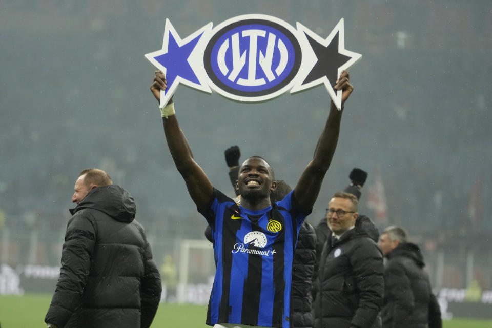 Inter Milan's Marcus Thuram celebrates at the end of the Serie A soccer match between AC Milan and Inter Milan at the San Siro stadium in Milan, Italy, Monday, April 22, 2024. (AP Photo/Luca Bruno)