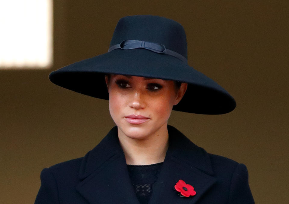 Meghan, Duchess of Sussex wearing a black hat and coat at the annual Remembrance Sunday memorial at The Cenotaph on November 10, 2019 in London, England