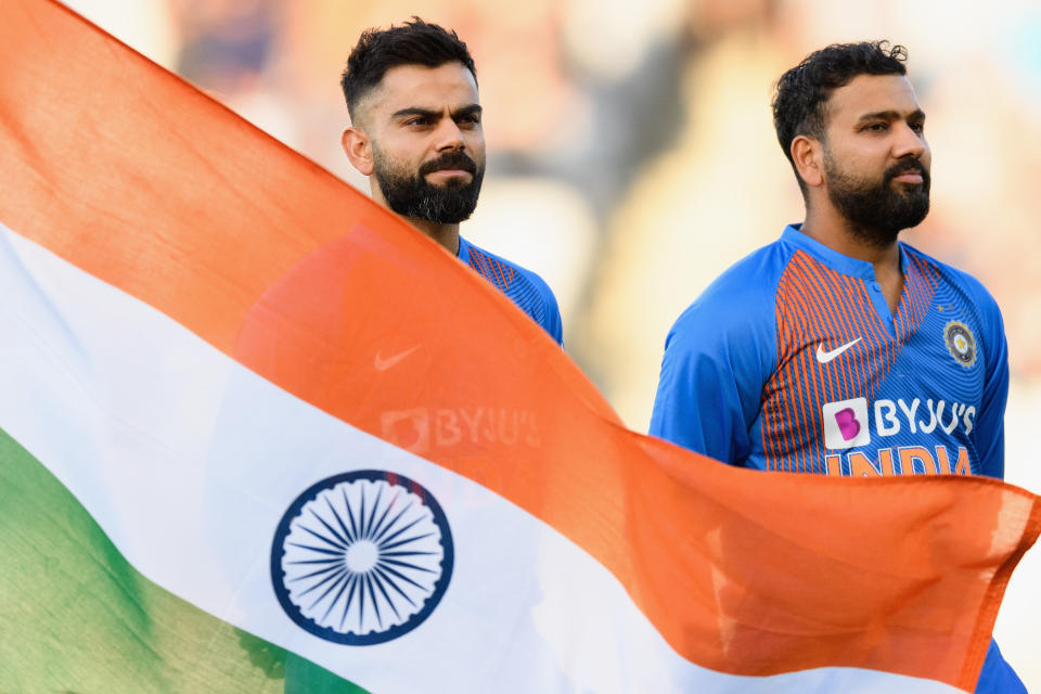 Captain Virat Kohli (pictured left) and vice-captain Rohit Sharma (pictured right) line up for their national anthem.