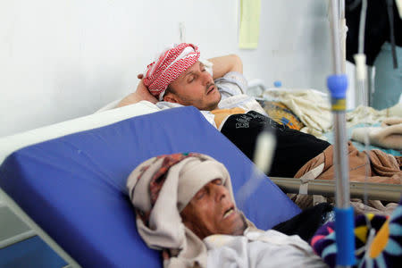 Men with cholera infected lie on beds at a hospital in Sanaa, Yemen May 12, 2017. REUTERS/Mohamed al-Sayaghi TPX IMAGES OF THE DAY