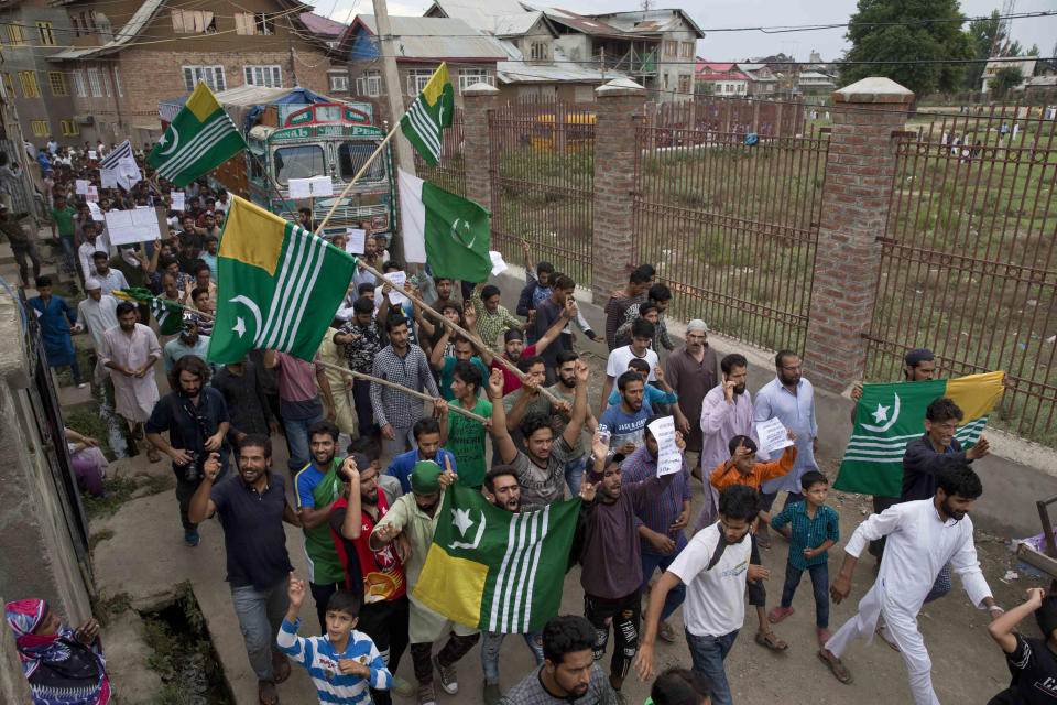 Kashmiri Muslims shout pro-freedom slogans during a demonstration after Friday prayers amid curfew like restrictions in Srinagar, India, Friday, Aug. 16, 2019. India's government assured the Supreme Court on Friday that the situation in disputed Kashmir is being reviewed daily and unprecedented security restrictions will be removed over the next few days, an attorney said after the court heard challenges to India's moves.(AP Photo/Dar Yasin)