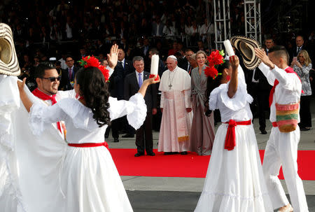 Pope Francis accompanied by Colombia's President Juan Manuel Santos and his wife Maria Clemencia Rodriguez watches traditional dance upon his arrival in Bogota, Colombia, September 6, 2017. REUTERS / Stefano Rellandini