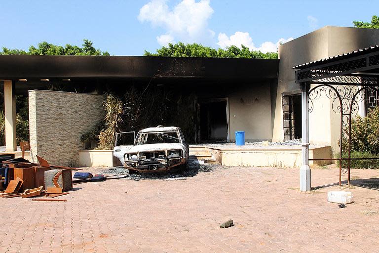 A burnt house and a car are seen inside the US Embassy compound on September 12, 2012 in Benghazi, Libya, following an overnight attack on the building